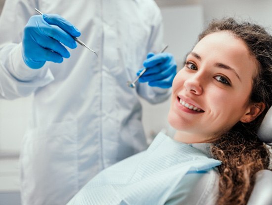 A young woman about to get a dental checkup and cleaning