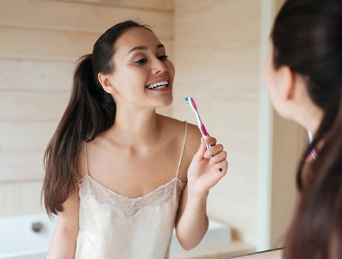 Woman holding a toothbrush